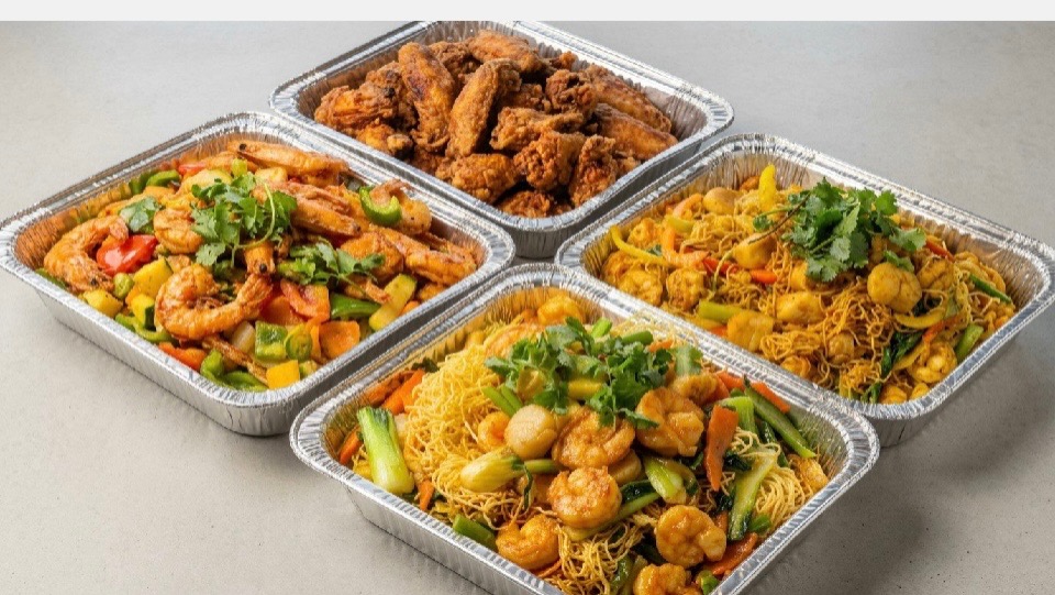 Eggymon catering trays with wings, shrimp, noodles and vegetables
